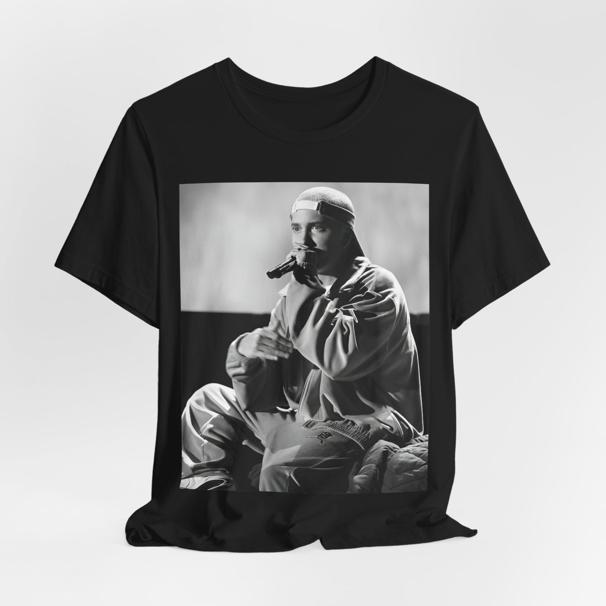 A black graphic t-shirt featuring a black and white graphic of Eminem as a 'Rap Messiah'.