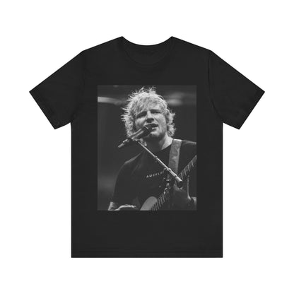 A black graphic t-shirt featuring a black and white photo of Ed Sheeran performing live.