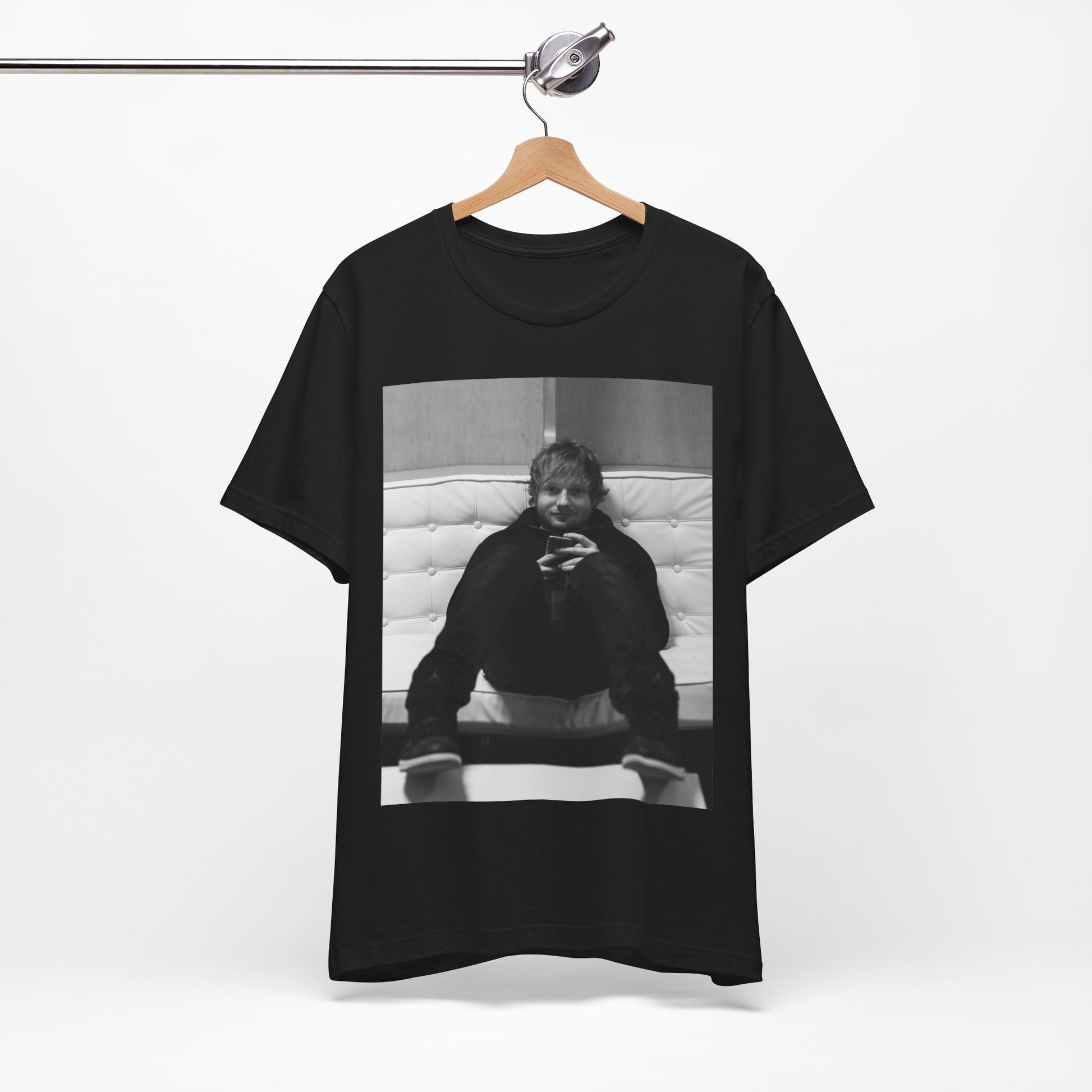 A black graphic t-shirt featuring a bold black and white graphic of Ed Sheeran.