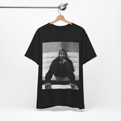 A black graphic t-shirt featuring a bold black and white graphic of Ed Sheeran.