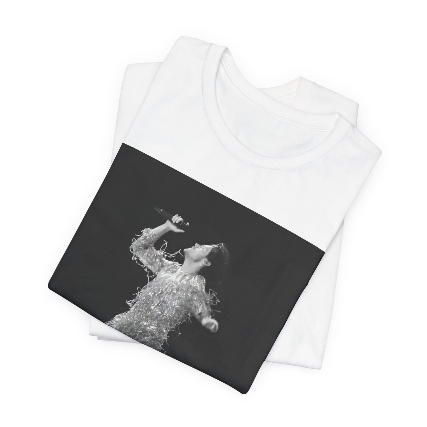 A black graphic t-shirt featuring a boxy pop aesthetic graphic of Harry Styles.