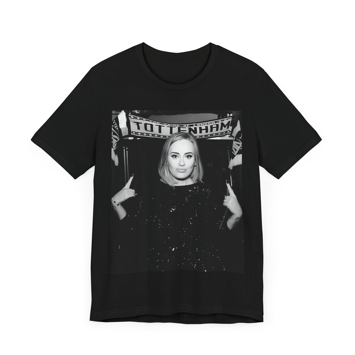 A black graphic t-shirt featuring a photo of Adele in a casual setting, surrounded by fans at a Tottenham event, showing her smiling or interacting.