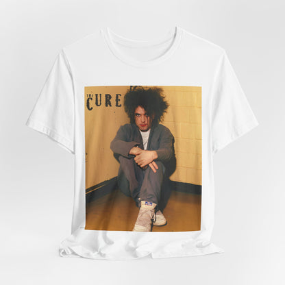 A black graphic t-shirt featuring a bold goth rock superstar graphic of The Cure.
