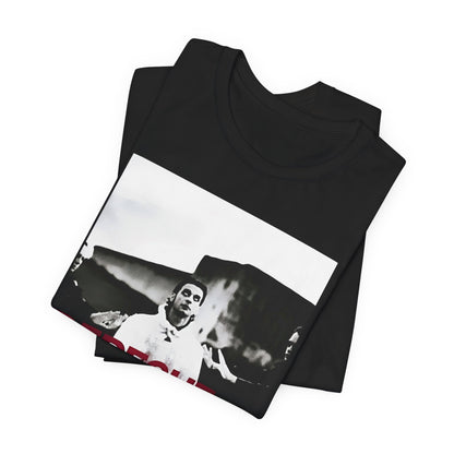 A black graphic t-shirt featuring a graphic related to Depeche Mode's 'Policy of Truth' song or era.