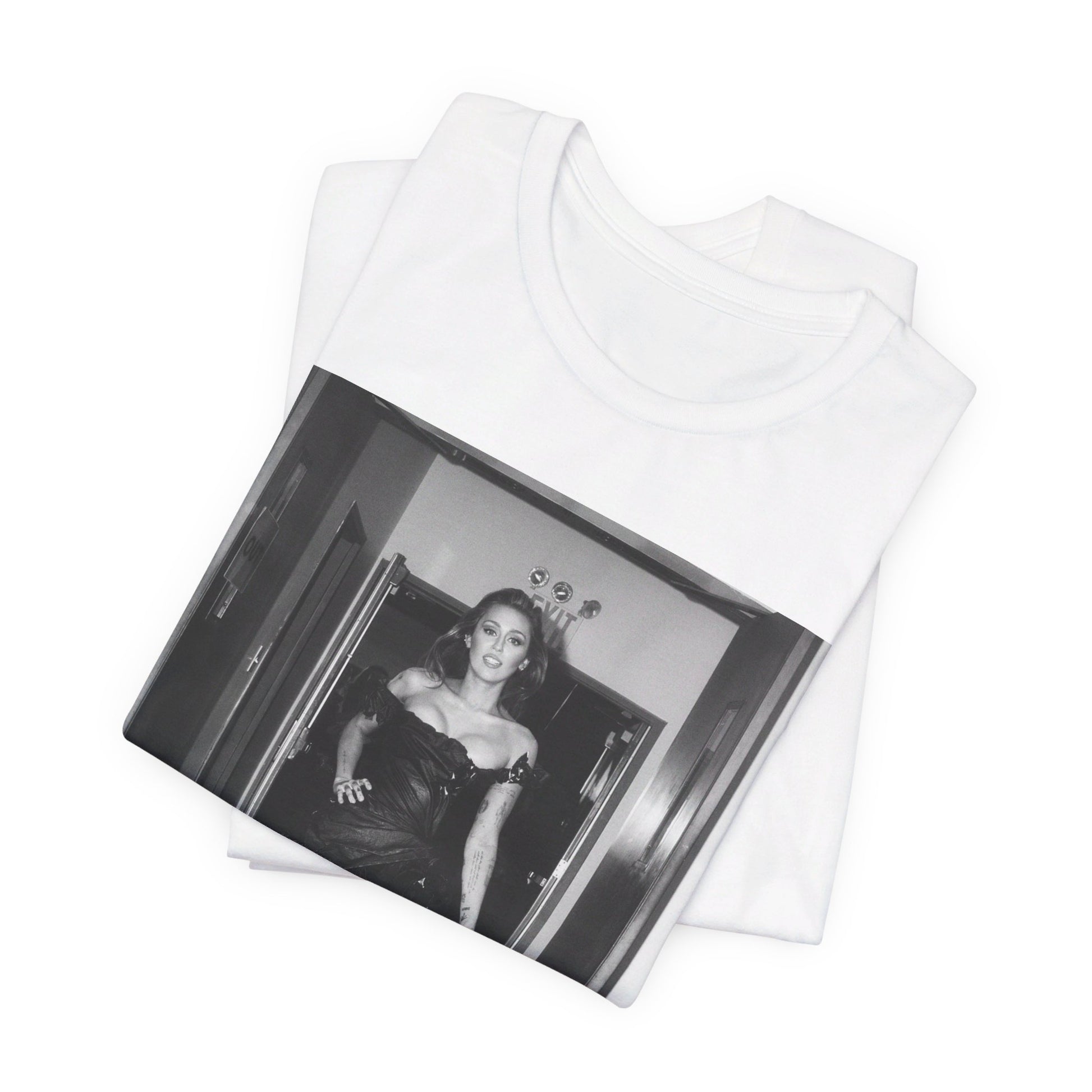 A black graphic t-shirt featuring a black and white graphic of Miley Cyrus in a cool pop rock style.