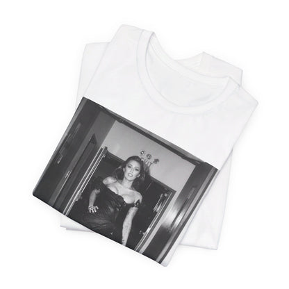 A black graphic t-shirt featuring a black and white graphic of Miley Cyrus in a cool pop rock style.