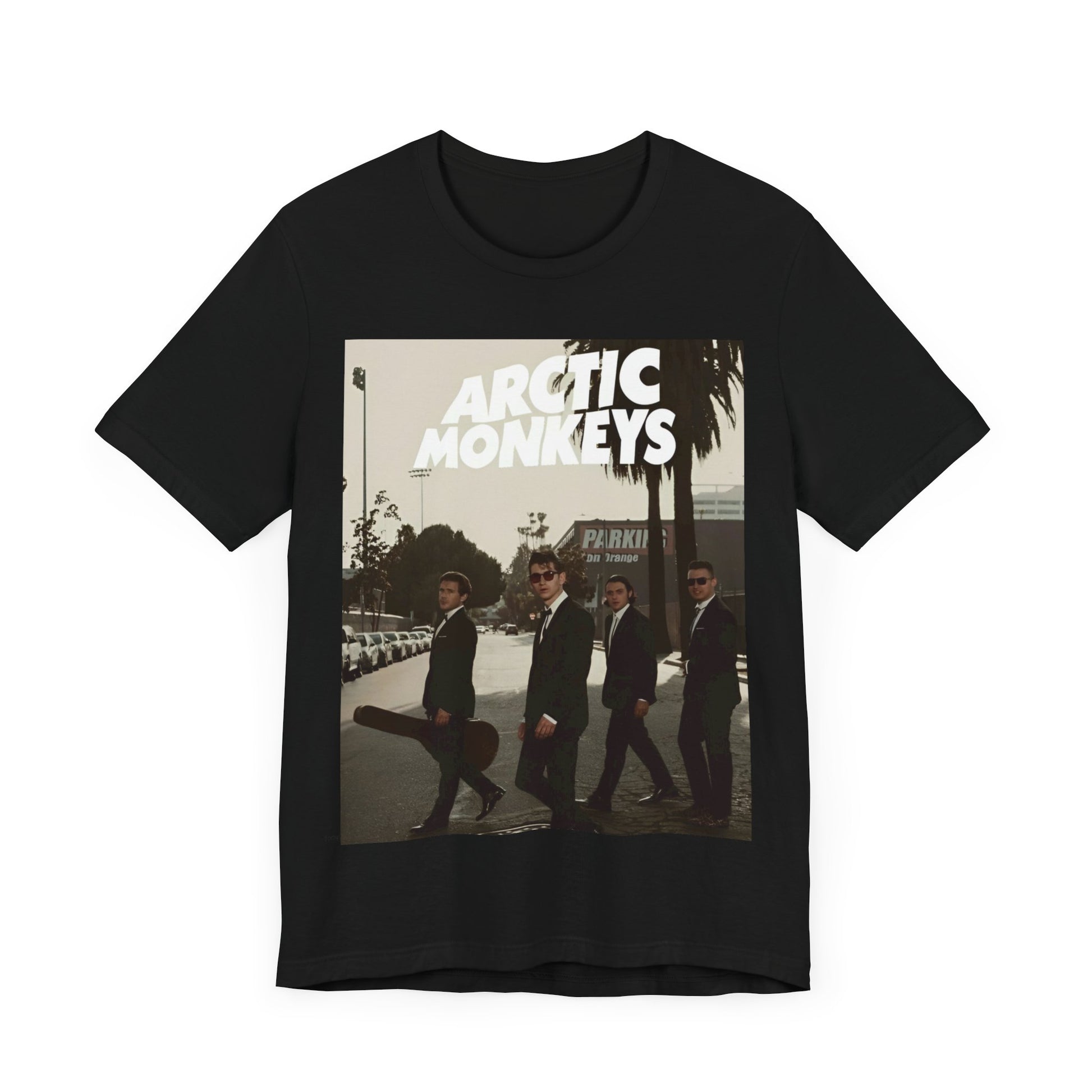 A black graphic t-shirt featuring Arctic Monkeys in a pose or setting similar to the iconic 'Abbey Road' album cover.