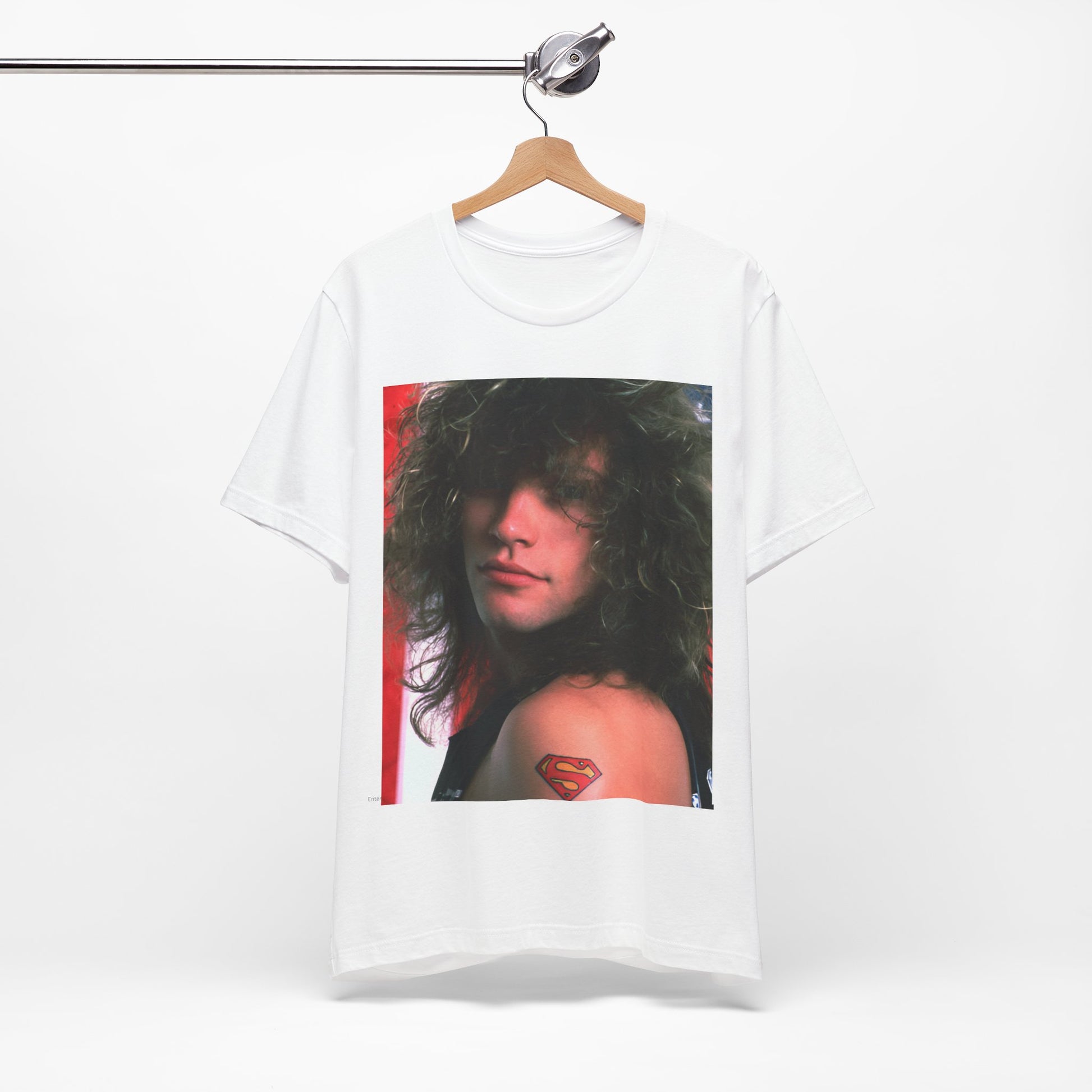 A black graphic t-shirt featuring a graphic of Bon Jovi, possibly with a Superman logo or a tattoo-inspired design.