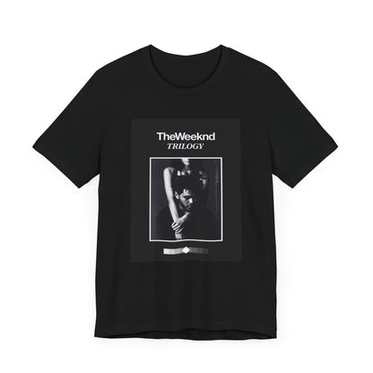 A black graphic t-shirt featuring a graphic related to The Weeknd's 'Trilogy' album.