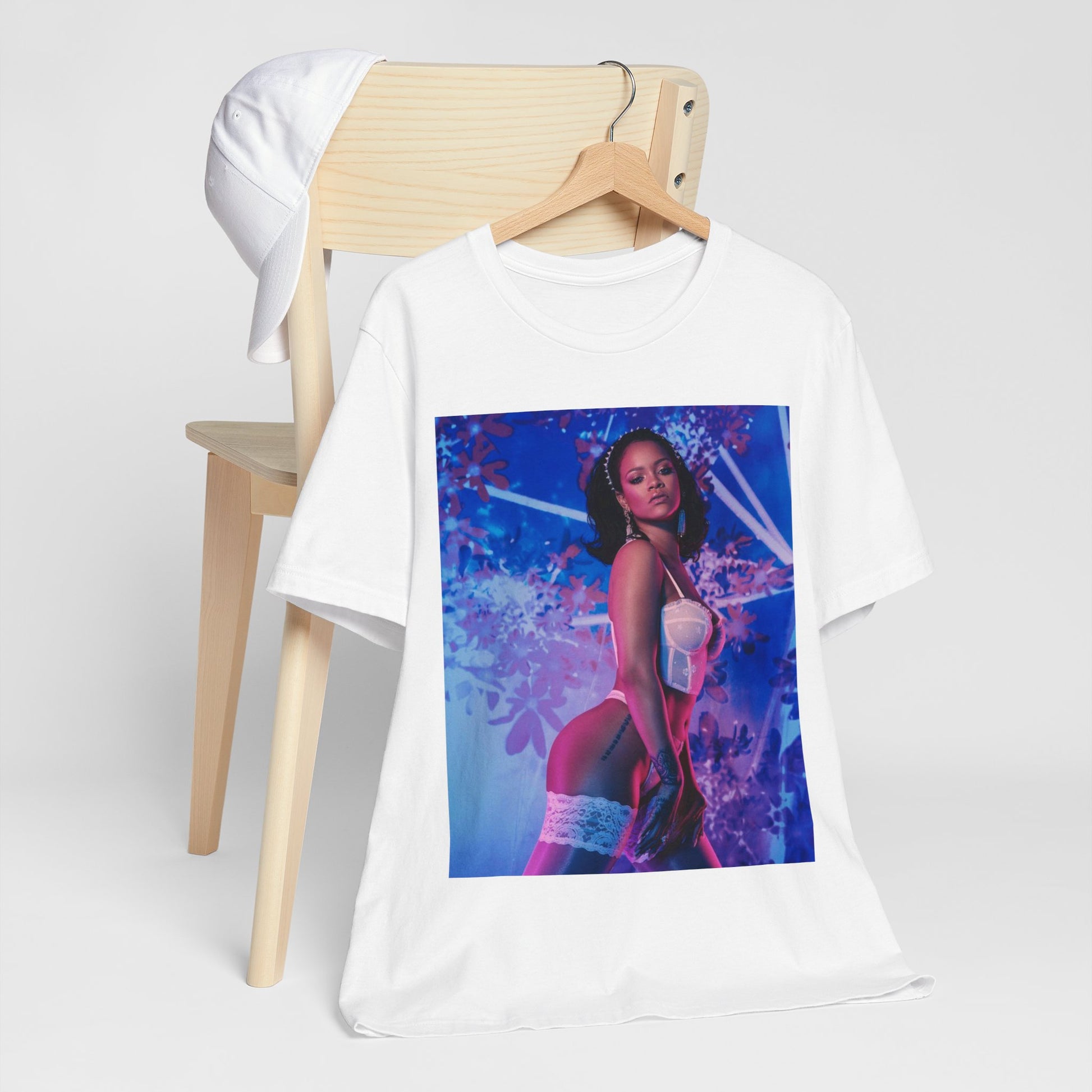 A black graphic t-shirt featuring a graphic of Rihanna as a lingerie goddess.
