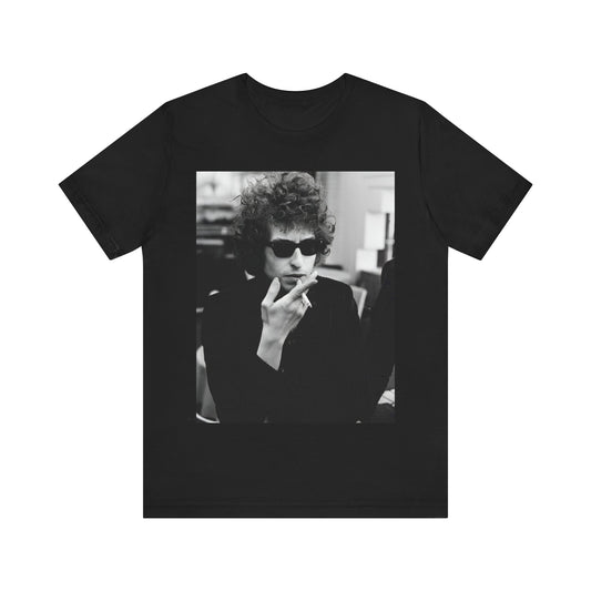 A black graphic t-shirt featuring a retro black and white graphic of Bob Dylan in a rebellious pose.
