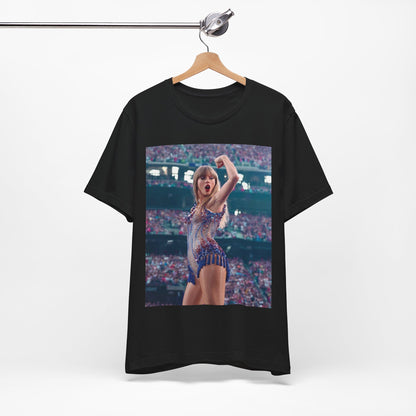 A black graphic t-shirt featuring a graphic or photo of Taylor Swift performing live on stage.