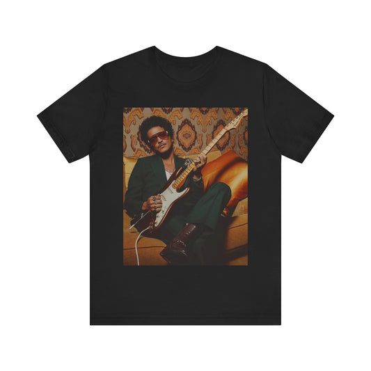 A black graphic t-shirt featuring a graphic of Bruno Mars playing guitar, emphasizing his funk legend status.