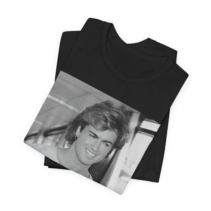 A black graphic t-shirt featuring an 80s black and white vintage photo or graphic of George Michael.