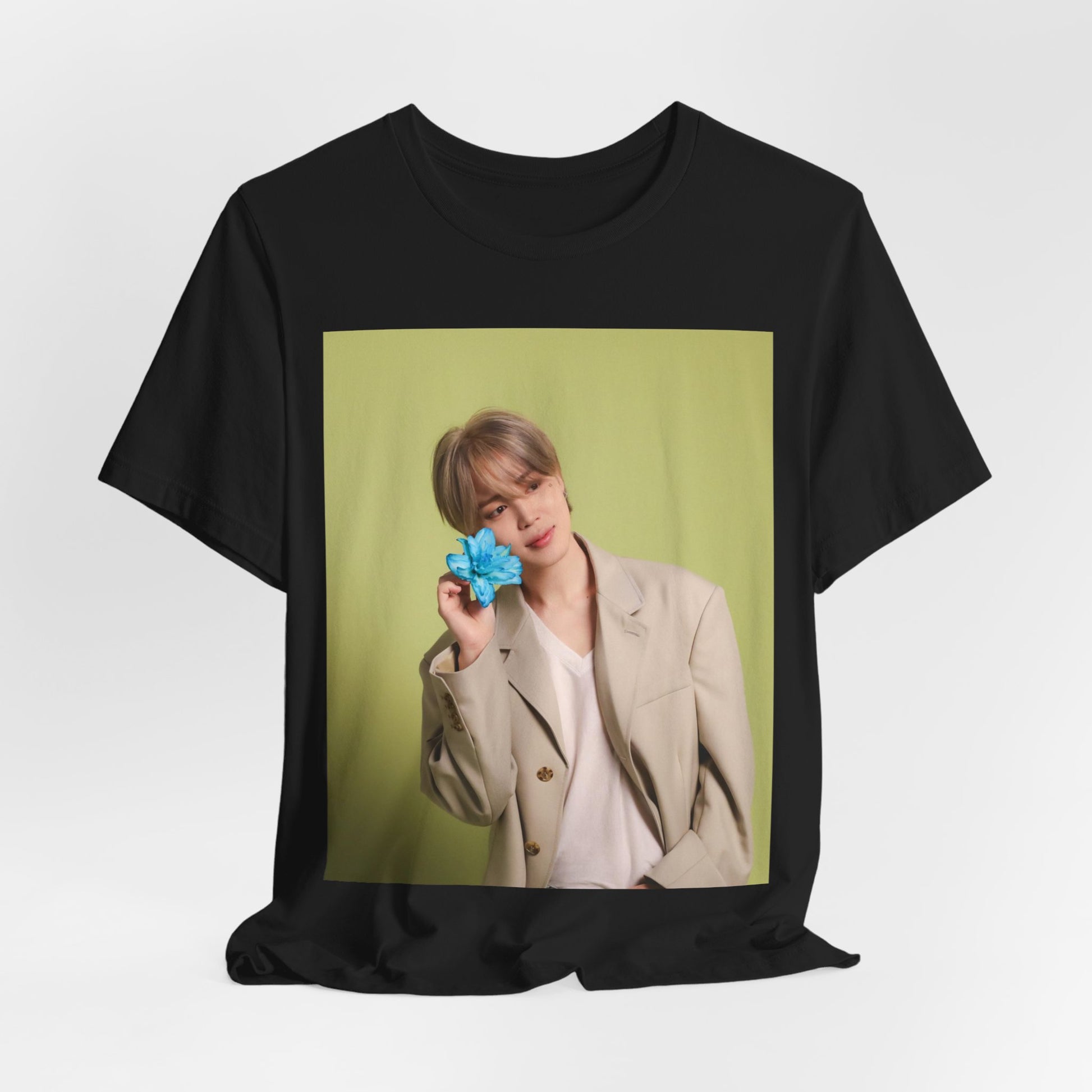 A black graphic t-shirt featuring a vintage K-Pop aesthetic graphic of Jimin.
