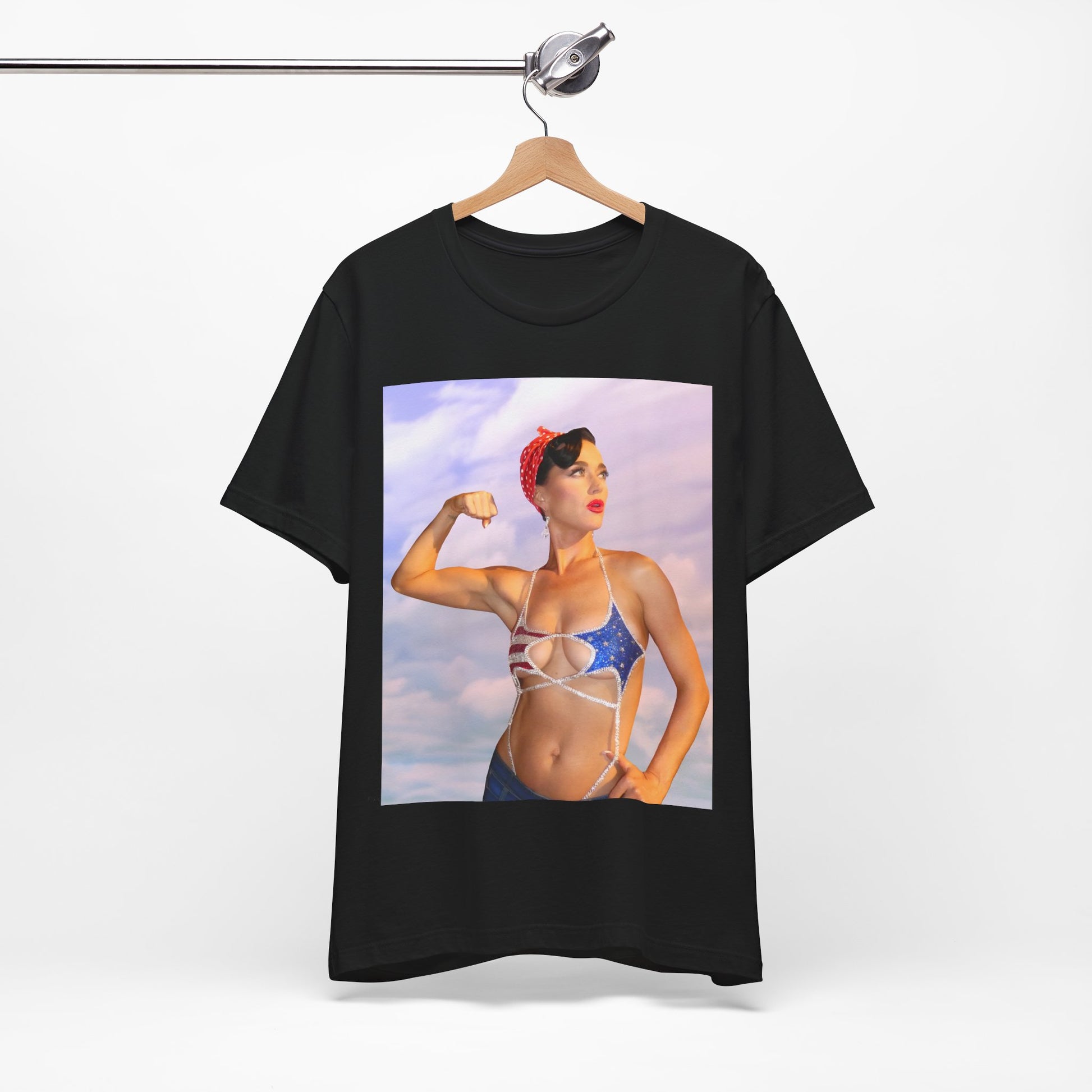 A black graphic t-shirt featuring a bold graphic of Katy Perry as a pop superstar.