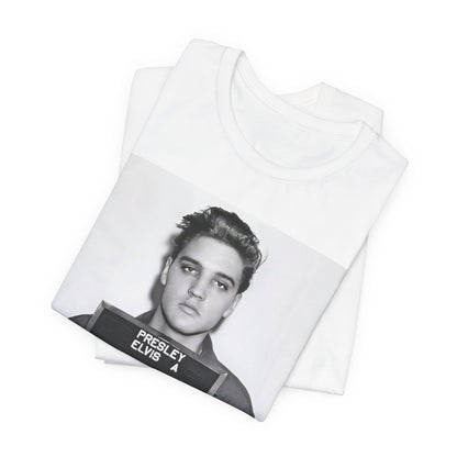 A black graphic t-shirt featuring a retro mugshot photo of Elvis Presley.