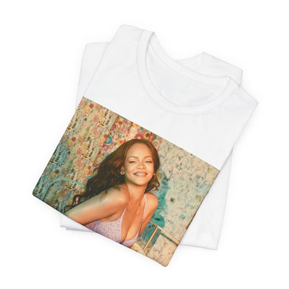 A black graphic t-shirt featuring a graphic of Rihanna with a beauty aesthetic.