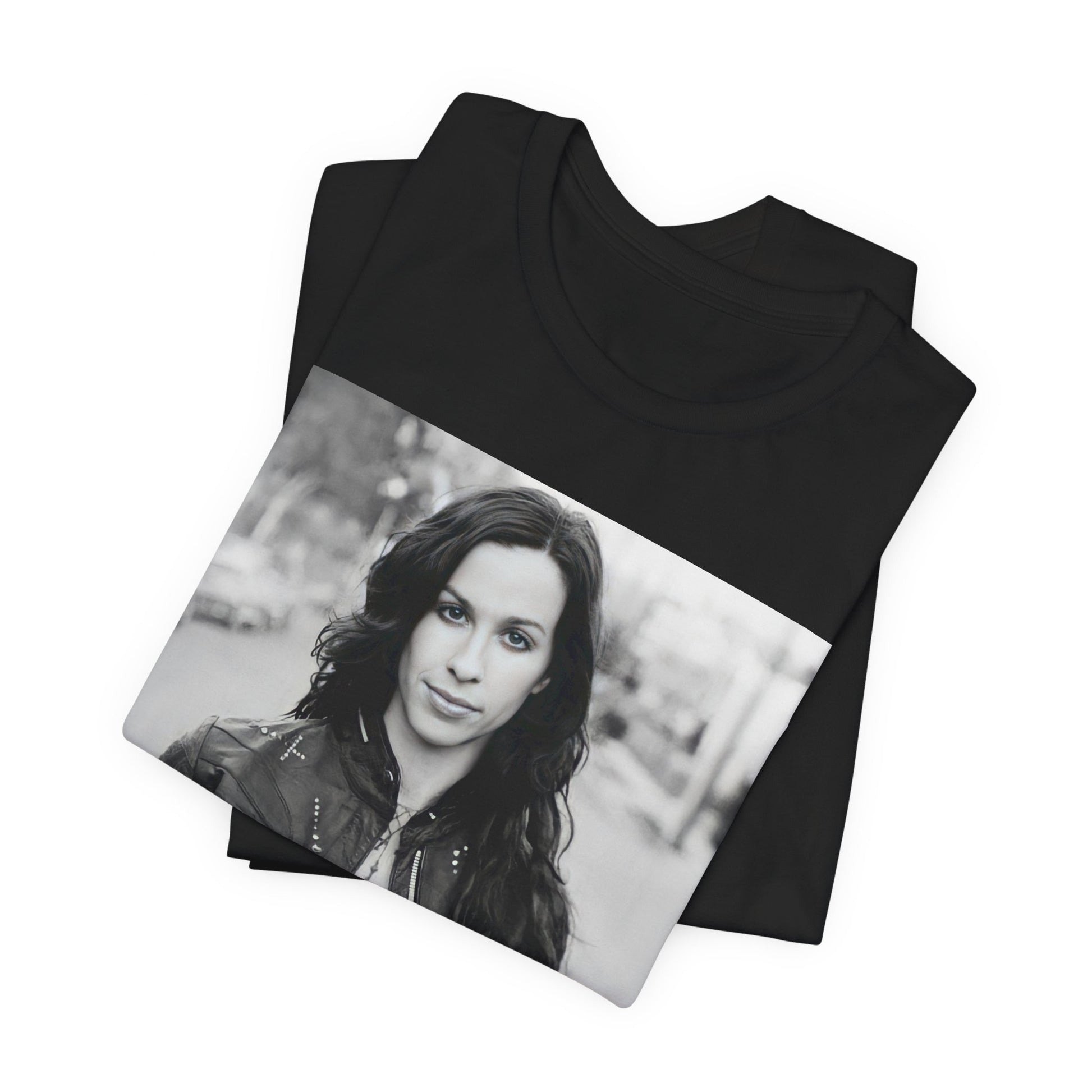 A black graphic t-shirt featuring a black and white photo of Alanis Morissette from 1998, showing her with a poised or thoughtful expression.