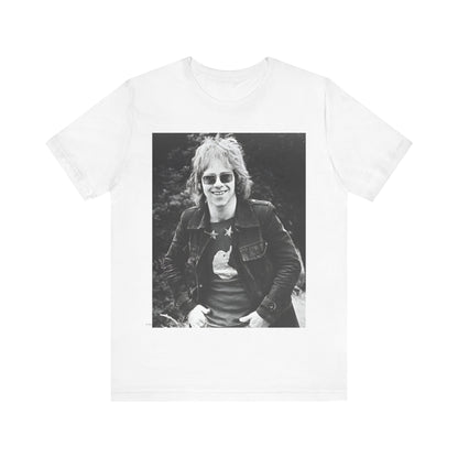 A black graphic t-shirt featuring a 70s black and white monochrome graphic or photo of Elton John.