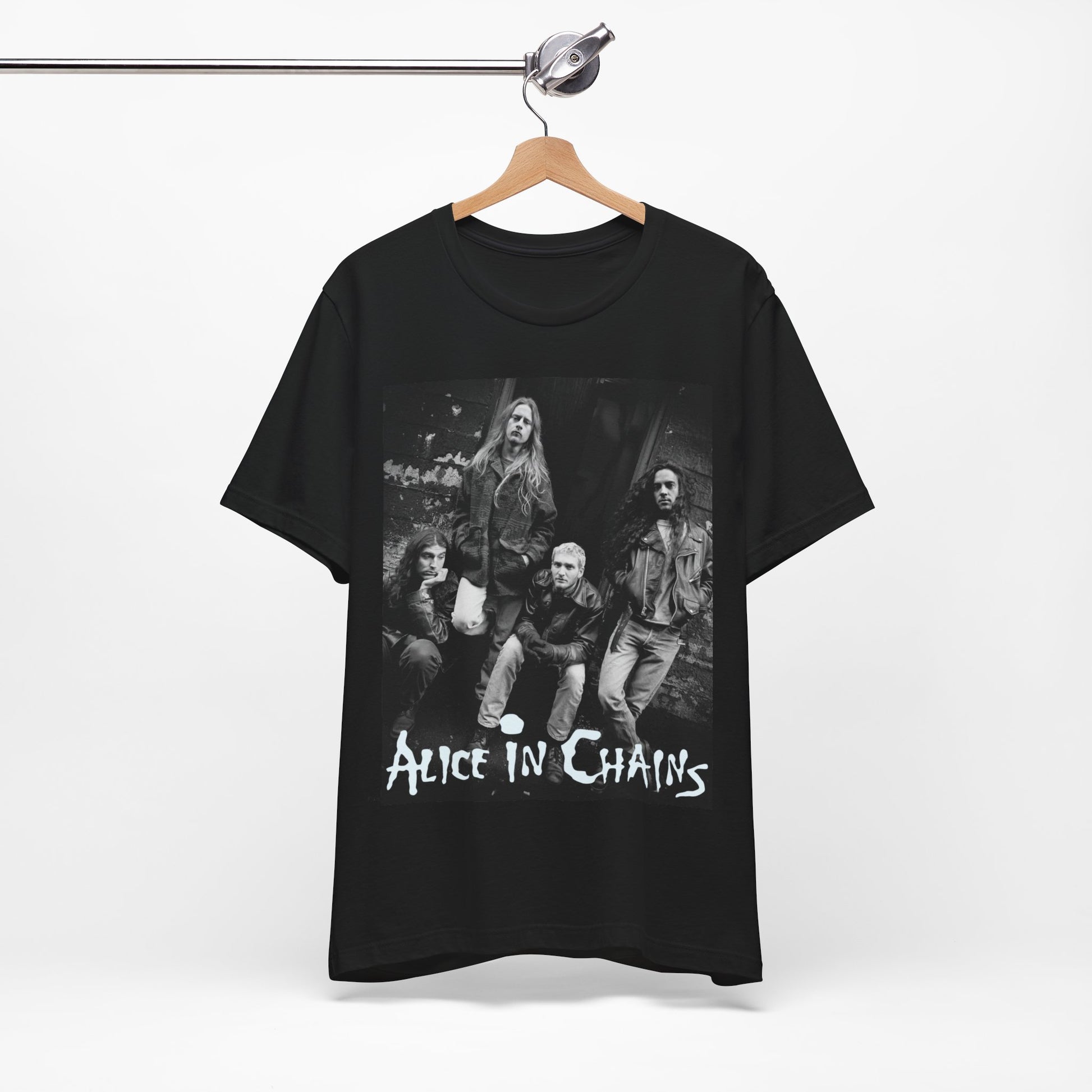 A black graphic t-shirt featuring a 90s black and white photographic portrait of the band Alice In Chains, capturing their iconic grunge look.