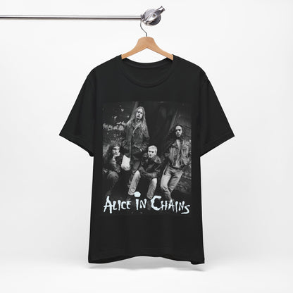 A black graphic t-shirt featuring a 90s black and white photographic portrait of the band Alice In Chains, capturing their iconic grunge look.