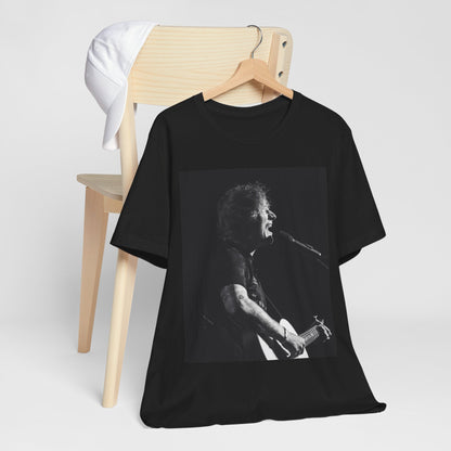 A black graphic t-shirt featuring a graphic related to Ed Sheeran's stadium tour.