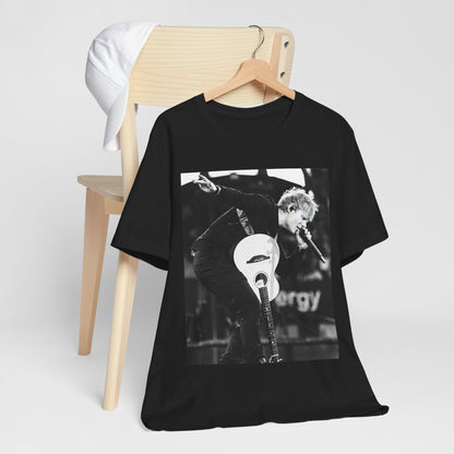A black graphic t-shirt featuring a vintage graphic of Ed Sheeran performing live.
