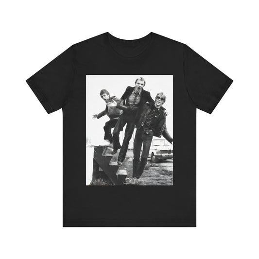 A black graphic t-shirt featuring an early days reggae rock graphic of The Police.