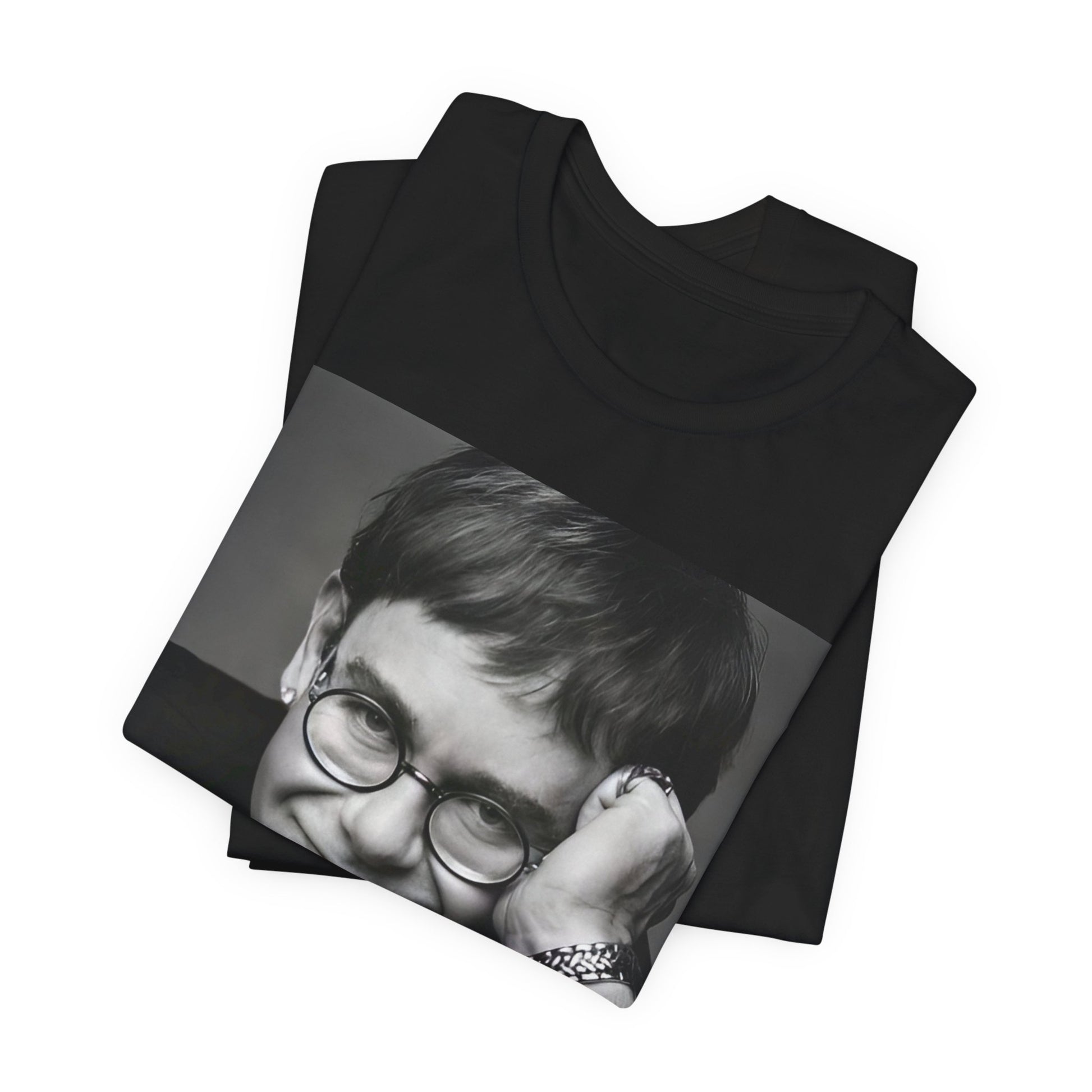 A black graphic t-shirt featuring a retro black and white photo portrait of Elton John.
