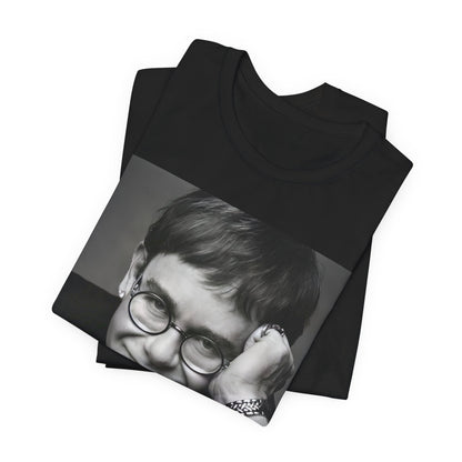 A black graphic t-shirt featuring a retro black and white photo portrait of Elton John.