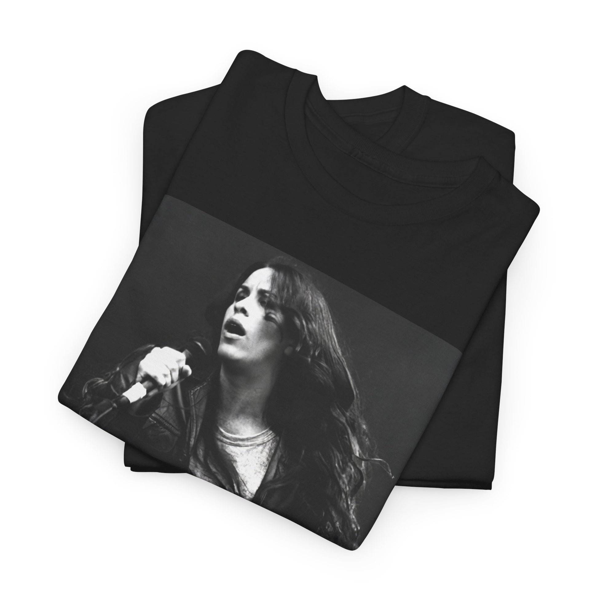A black graphic t-shirt featuring a 90s-style concert graphic of Alanis Morissette, related to her "Jagged Little Pill" era tours.