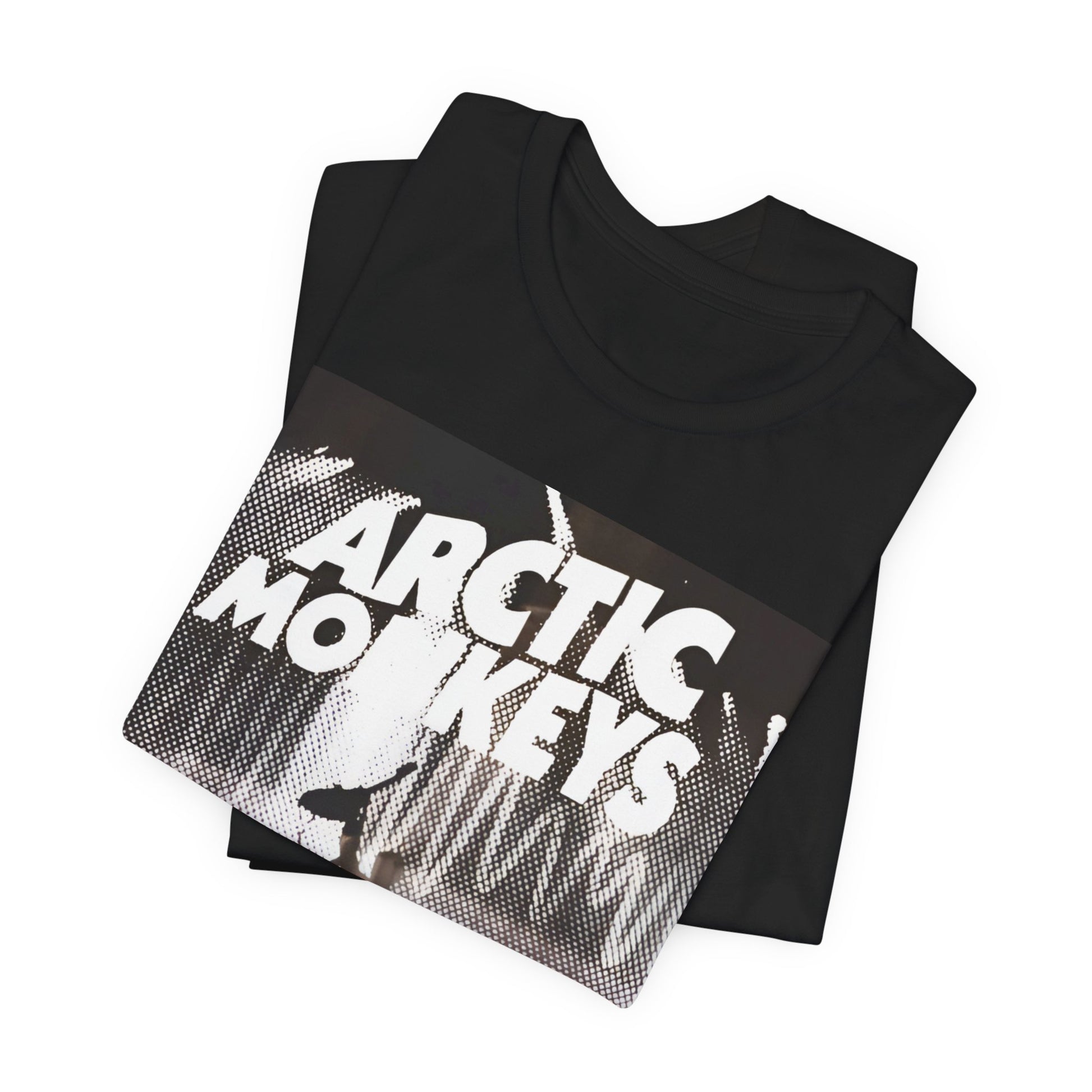 A black graphic t-shirt featuring a retro-style logo for the band Arctic Monkeys.