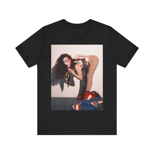 A black graphic t-shirt featuring a graphic of Chappell Roan with a 'Hot to Go!' theme, emphasizing her drag icon persona.