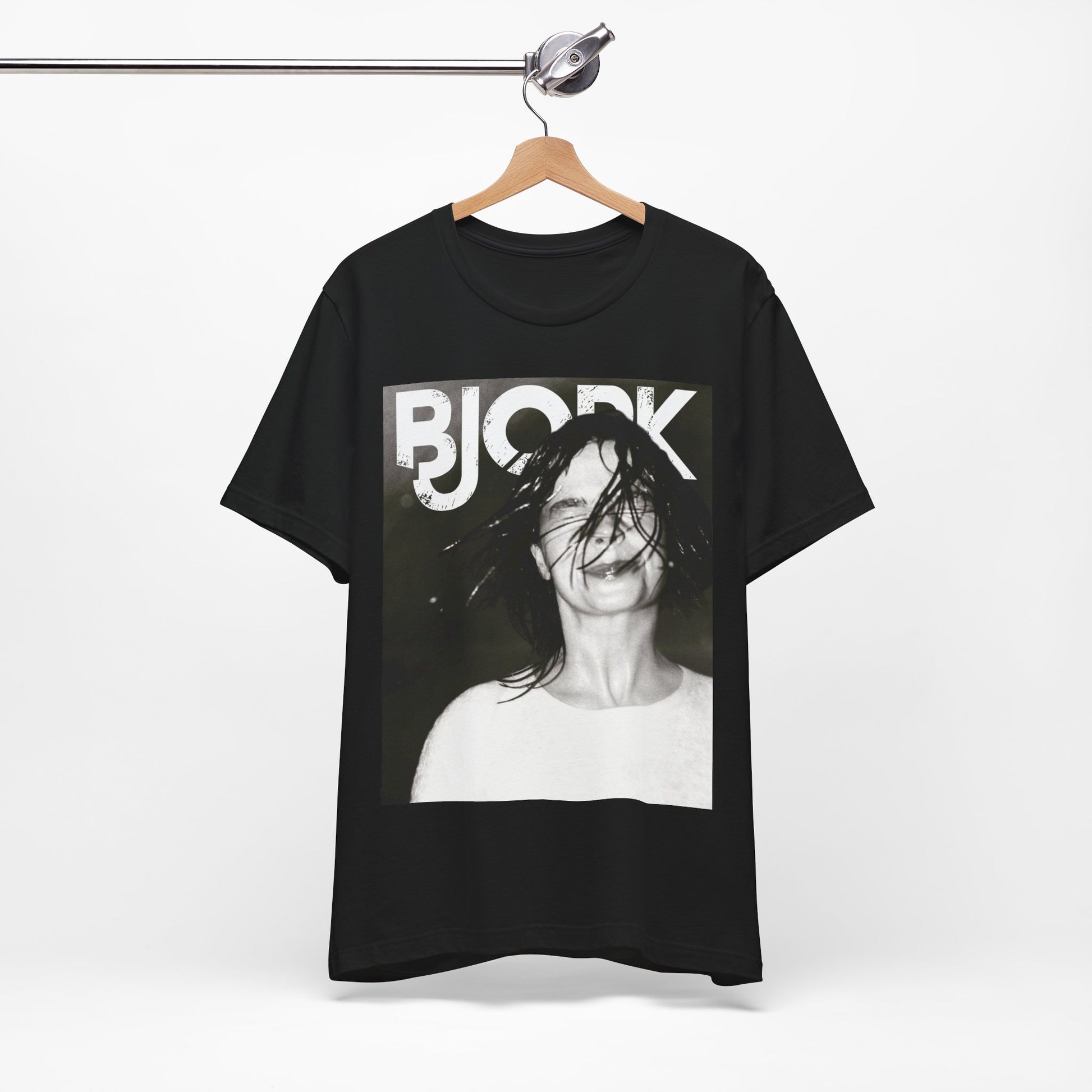 A black graphic t-shirt featuring a dark, artistic graphic of Bjork, possibly with a mysterious or otherworldly feel.