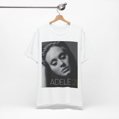 A black graphic t-shirt featuring the album cover art for Adele's '21' album, showing a close-up portrait of her with a contemplative expression.