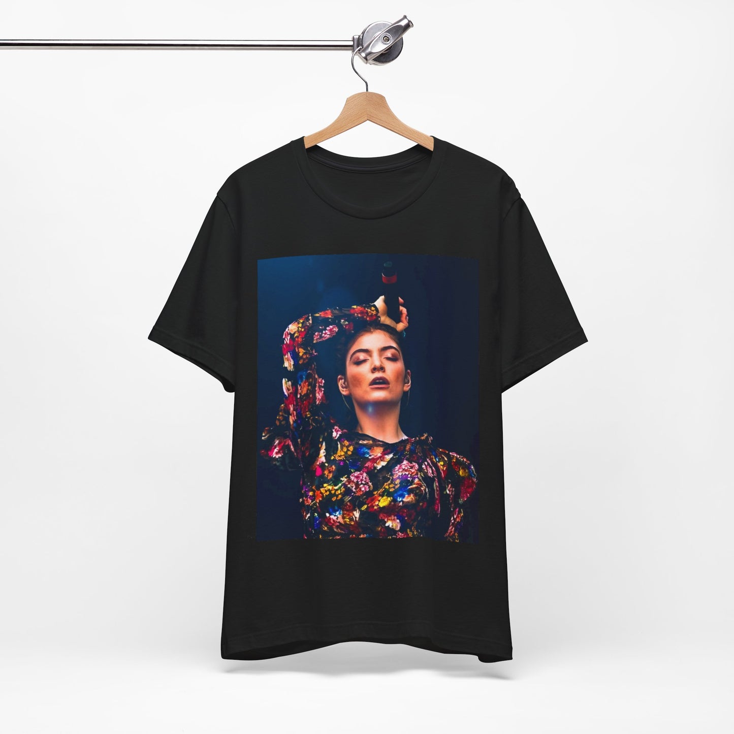 A black graphic t-shirt featuring a retro graphic related to Lorde's 'Pure Heroine' album era.