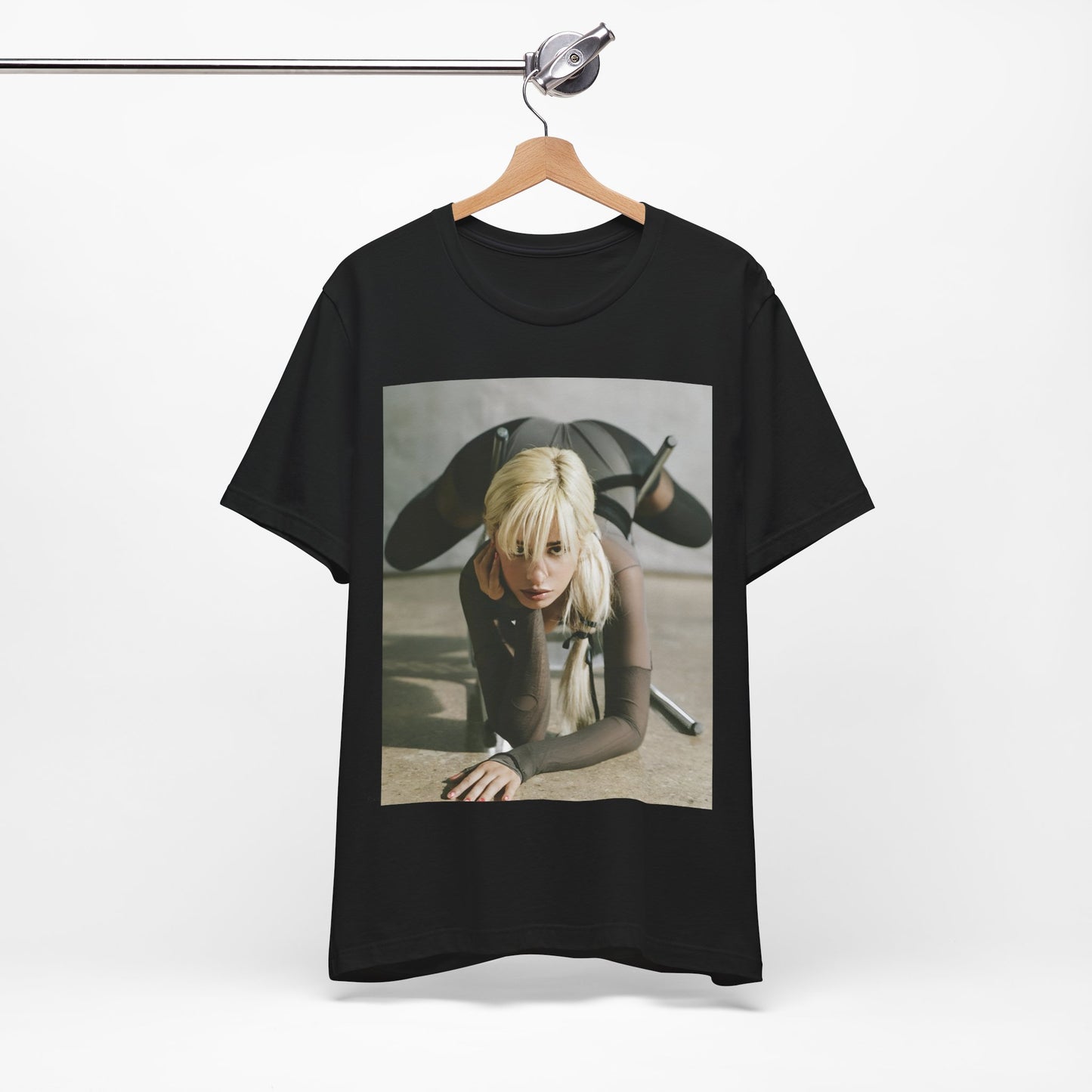 A black graphic t-shirt featuring a vintage-style graphic of Camila Cabello, possibly with a crown or 'Pop Queen' title.