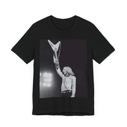 A black graphic t-shirt featuring a graphic or photo of Tom Petty playing guitar on stage.