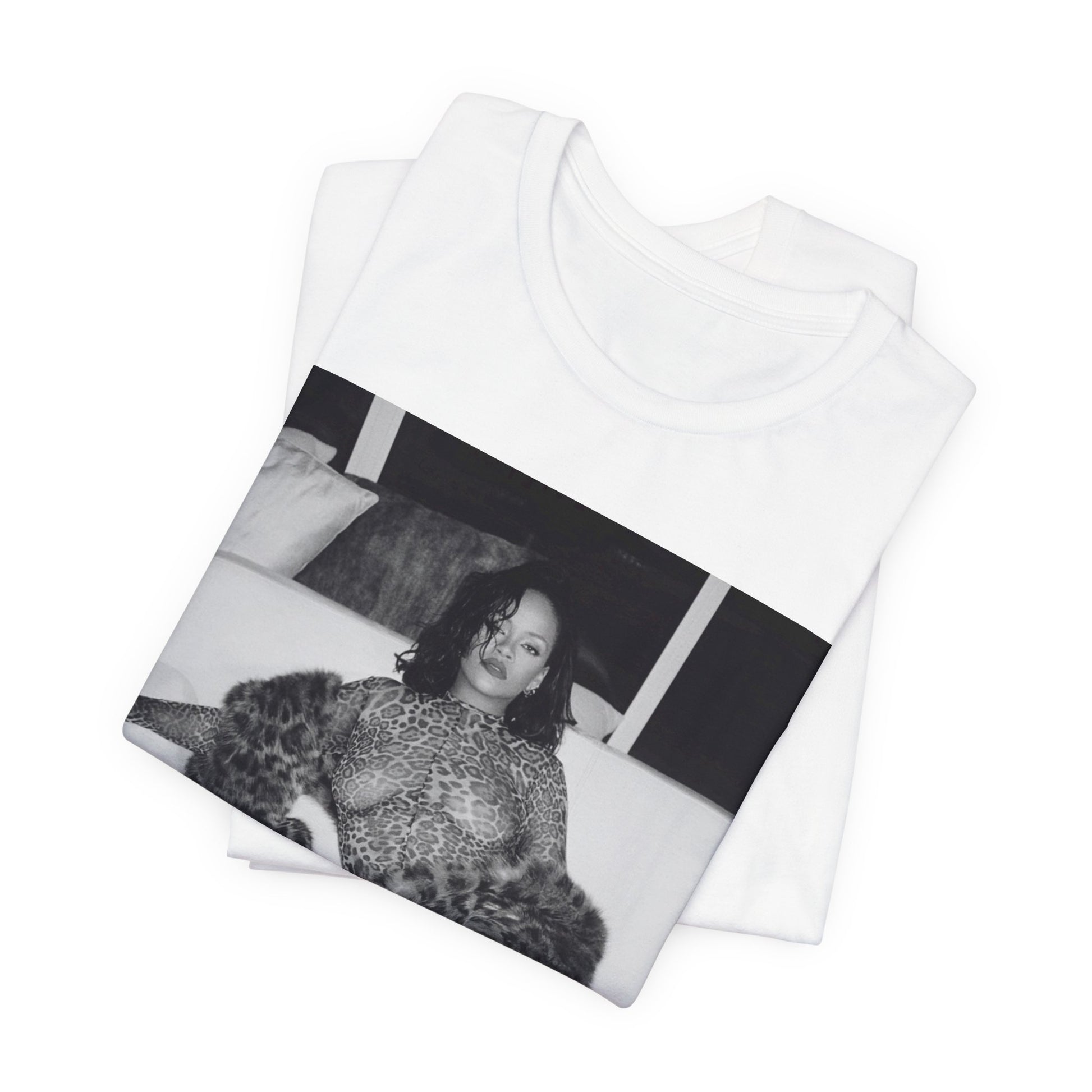 A black graphic t-shirt featuring a black and white, monochrome graphic or photo of Rihanna in a sexy pose.
