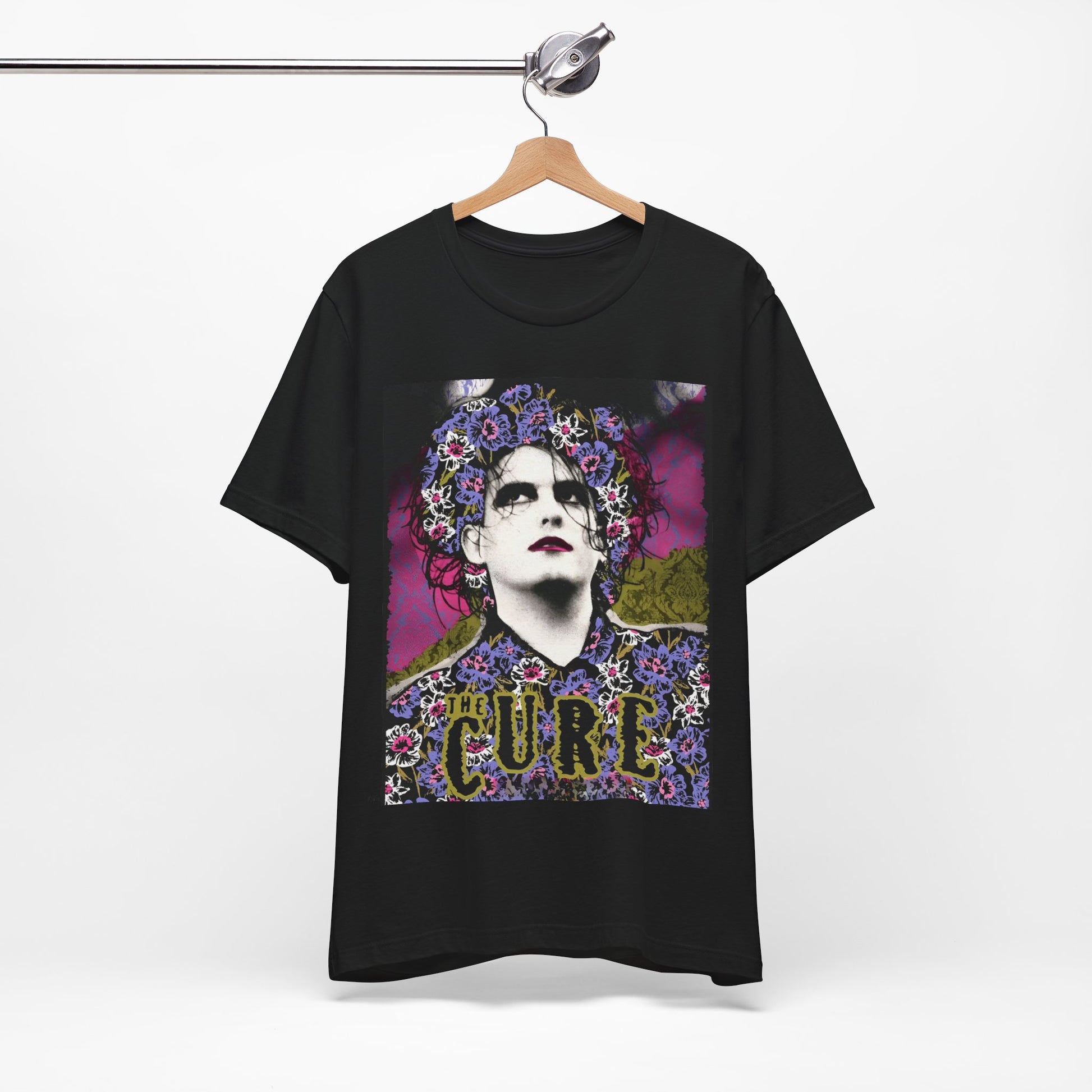 A black graphic t-shirt featuring a retro rock aesthetic pop art graphic of The Cure.
