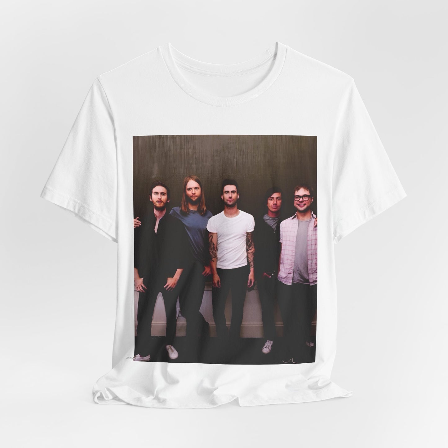 A black cotton Maroon 5 t-shirt featuring a graphic of an artistic, emotional heart design.