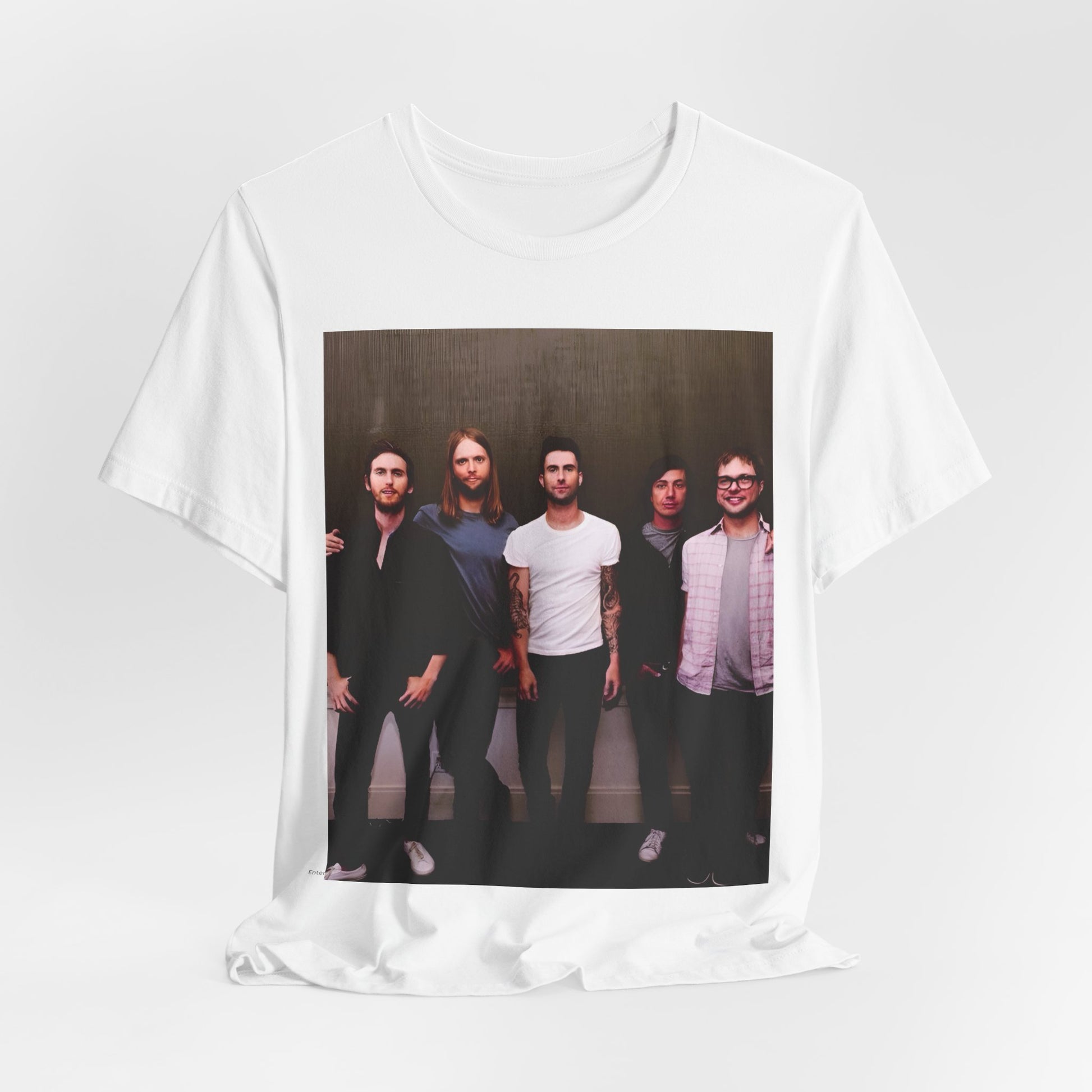 A black cotton Maroon 5 t-shirt featuring a graphic of an artistic, emotional heart design.