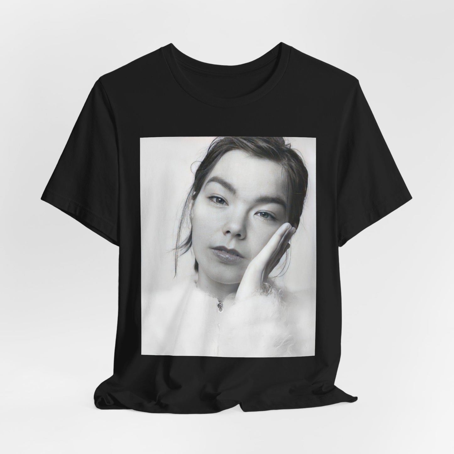 A black graphic t-shirt featuring a graphic related to Bjork's 'Post' album era, possibly with album art elements.