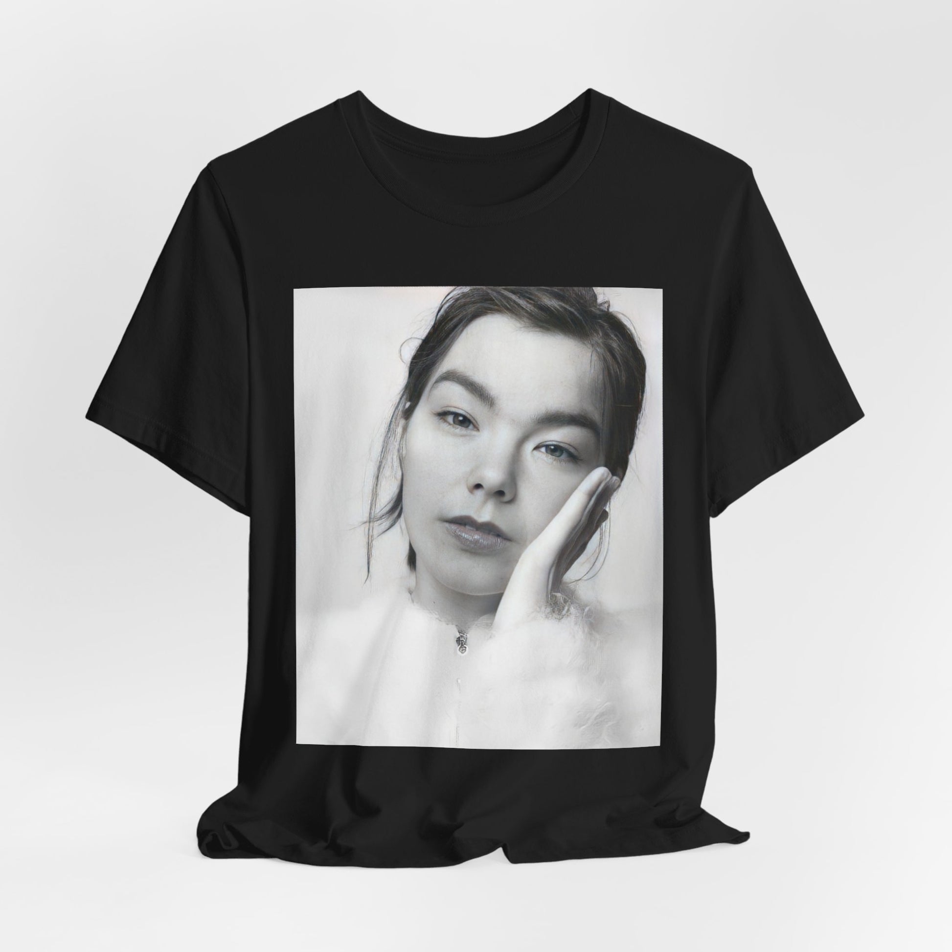 A black graphic t-shirt featuring a graphic related to Bjork's 'Post' album era, possibly with album art elements.