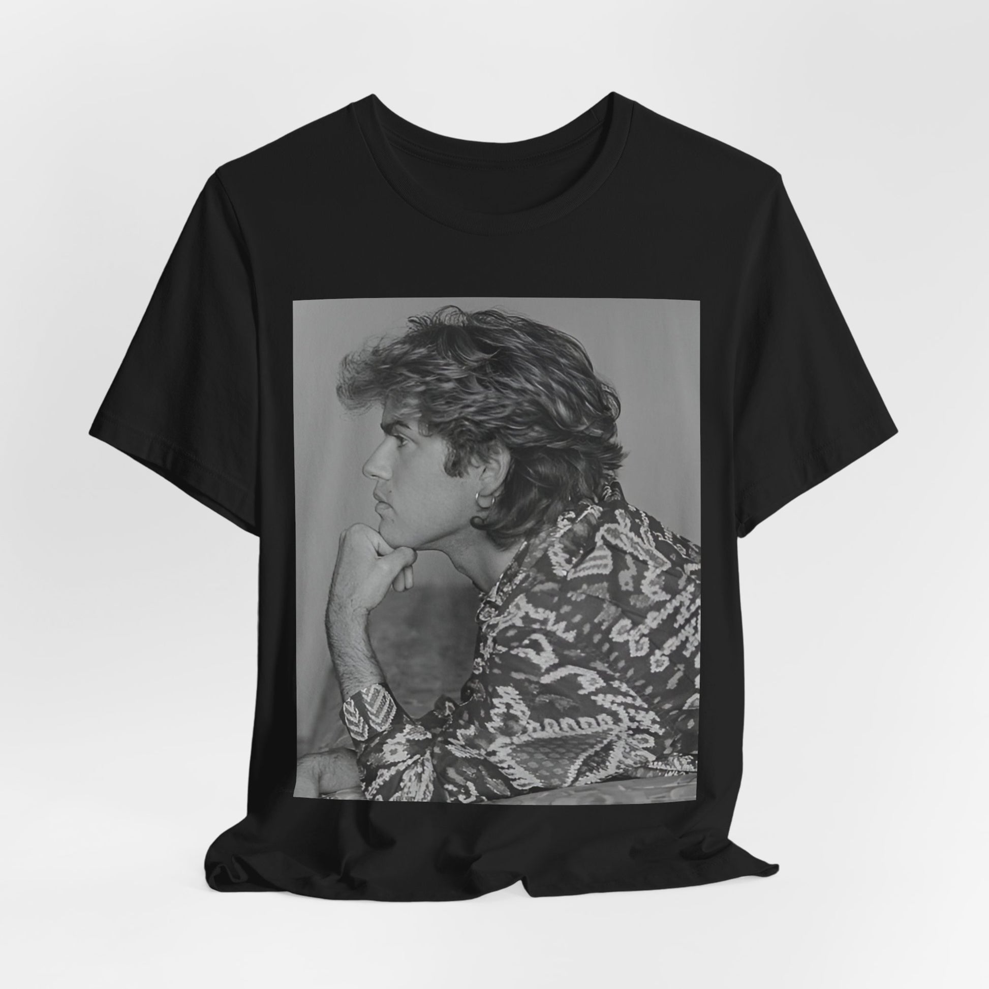 A black graphic t-shirt featuring a graphic of George Michael from his 80s Wham! era.