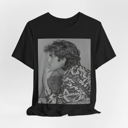 A black graphic t-shirt featuring a graphic of George Michael from his 80s Wham! era.
