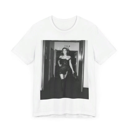 A black graphic t-shirt featuring a black and white graphic of Miley Cyrus in a cool pop rock style.