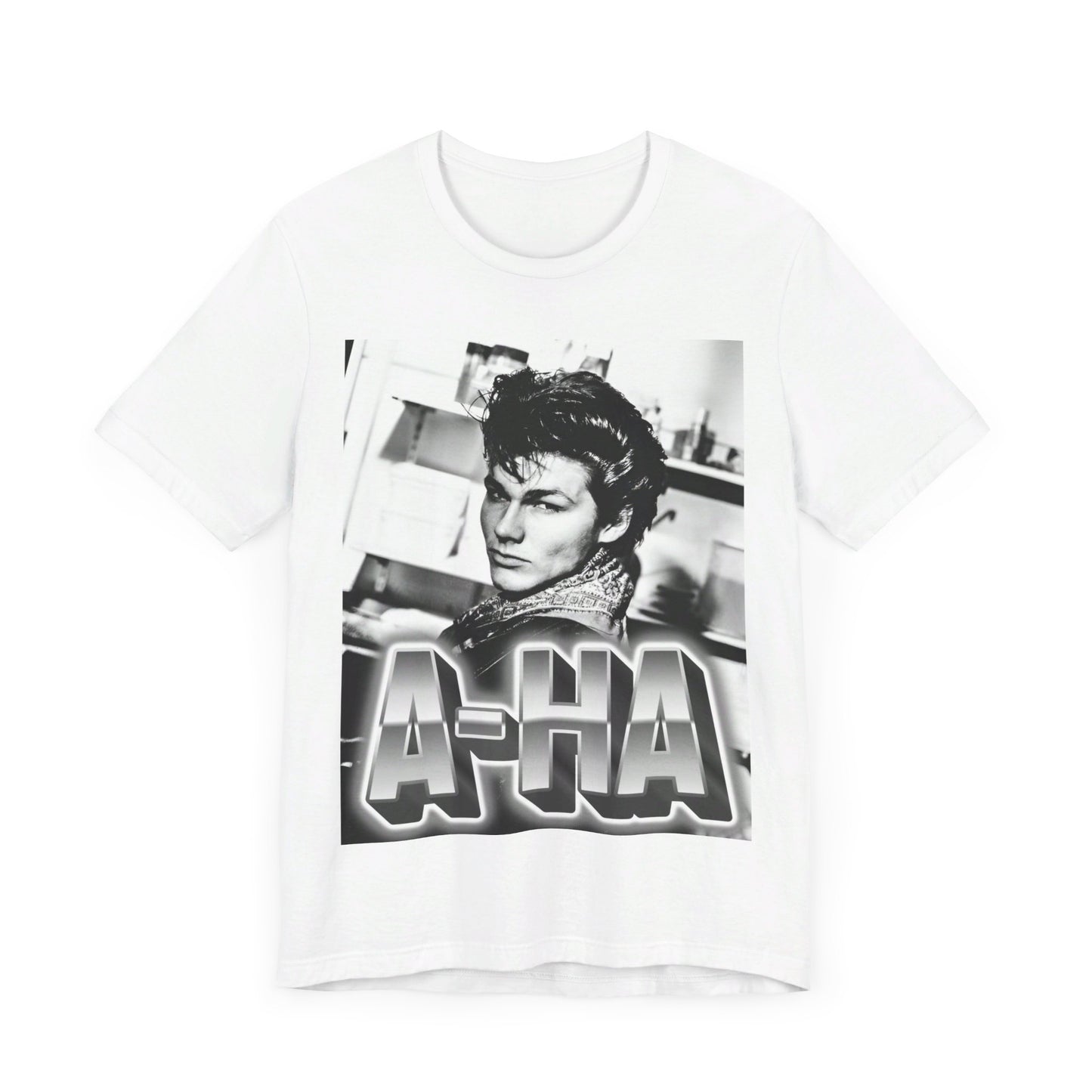 A black graphic t-shirt featuring a retro 1986-style graphic for the band A-HA, possibly with band members in a stylized design.