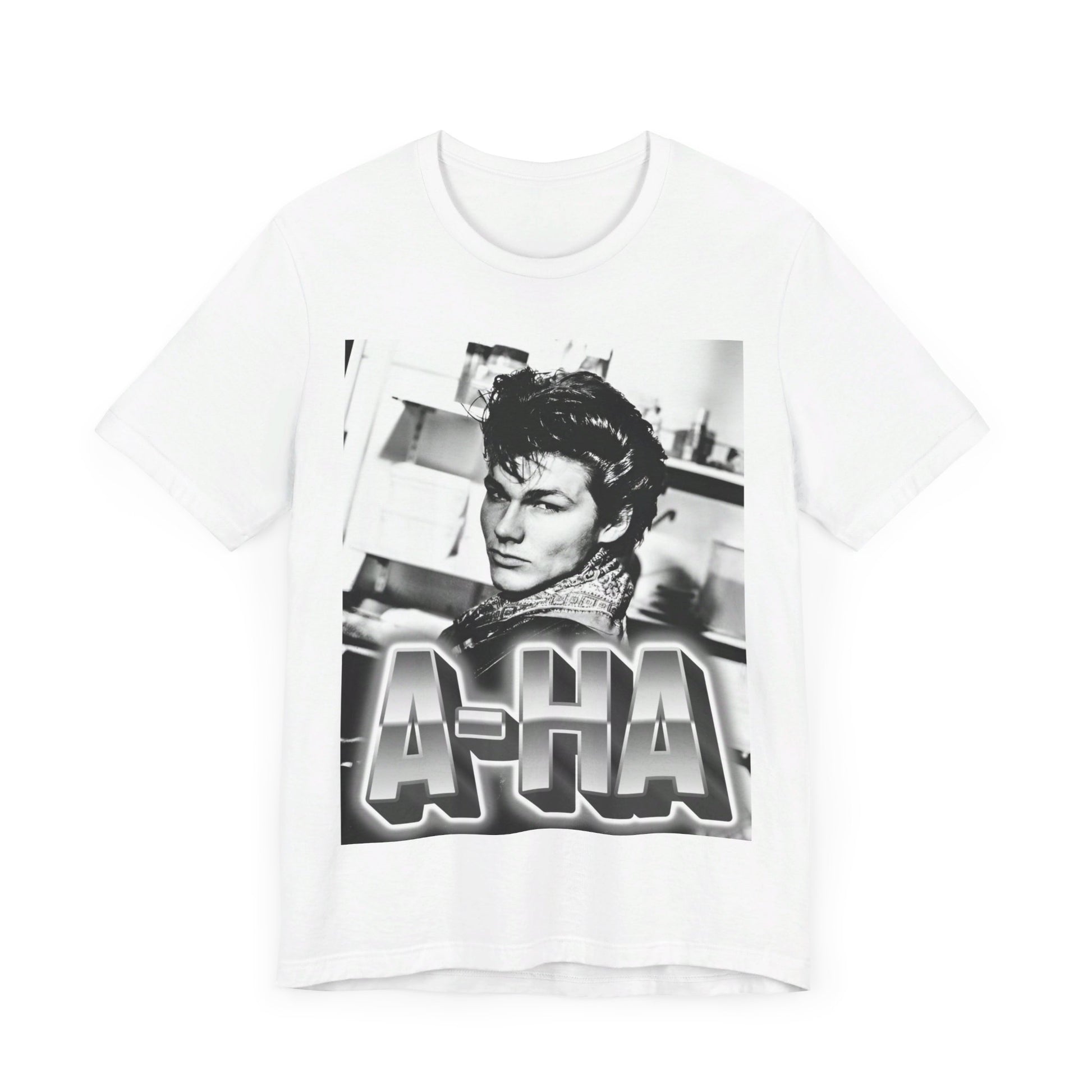 A black graphic t-shirt featuring a retro 1986-style graphic for the band A-HA, possibly with band members in a stylized design.